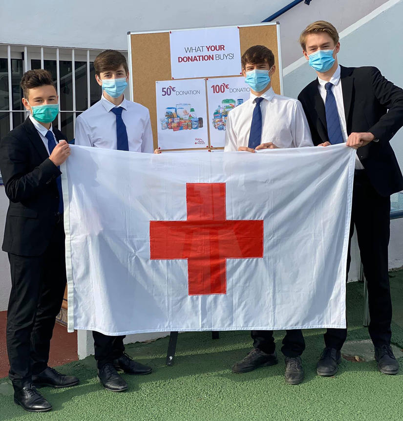 Sixth Formers donate proceeds of trading shares to Red Cross